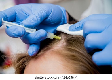 Beautician and the patient in the clinic of aesthetic medicine. The injection.