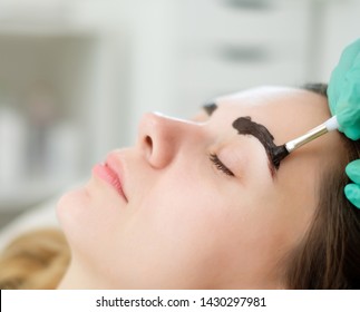 Beautician Performing Henna Brows Correction