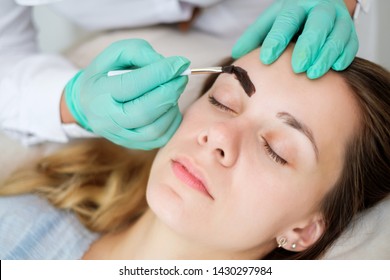 Beautician Performing Henna Brows Correction