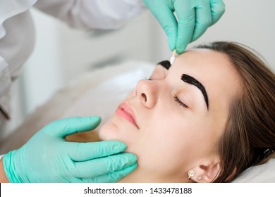 Beautician Performing Henna Brows Correction