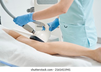 Beautician processing hip with vela shape apparatus - Shutterstock ID 2161411941