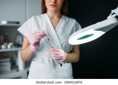 Beautician with syringe in hands, botox injection - Shutterstock ID 1404515876