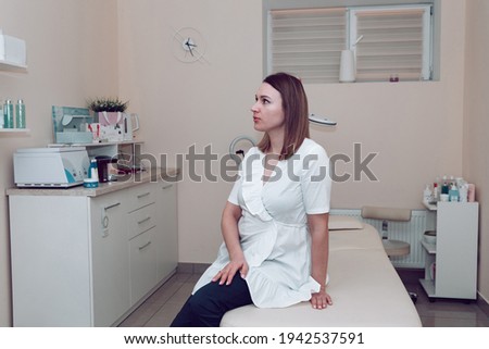 Similar – Female doctor filling out questionnaire to a senior patient