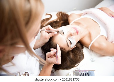 Beautician Working On Upgrading Silk Eyelashes In A Beauty Studio.