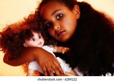 Beautiful 10 Year Old African Amercain Girl With Baby Doll In Goth Theme.