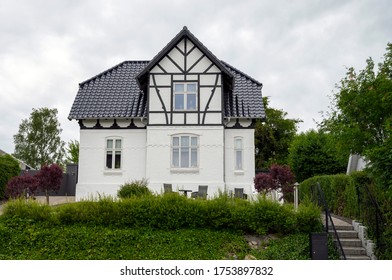 Beautiful 2 Story White House With A Black Roof - Taken On A Cloudy Summer Day