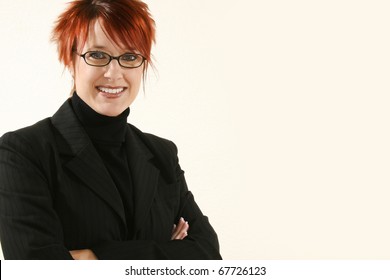 Beautiful 30 Year Old Business Woman In Black Suit With Kind  Expression.  With Glasses.