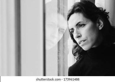 Beautiful 35 Year Old Woman Stands In Front Of The Window