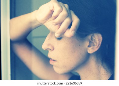 Beautiful 35 Year Old Woman Stands In Front Of The Window