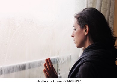 Beautiful 35 Year Old Woman Stands In Front Of The Window