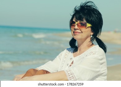 Beautiful 50 Years Old Woman Walking On The Beach