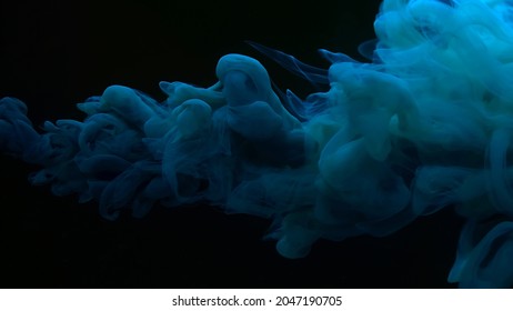 Beautiful Abstract Background. Blue-green Watercolor Paints In Water On A Black Background. Chic Wallpaper For Your Desktop. Creative Hyptonic Background. Blue-green Cloud Of Ink On A Black Background