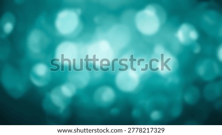 A beautiful abstract background features soft teal bokeh with blurred, out-of-focus light spheres, creating a dreamy effect.