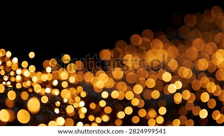 A beautiful abstract background featuring numerous golden bokeh lights scattered across a dark, black canvas, creating a magical and festive atmosphere.