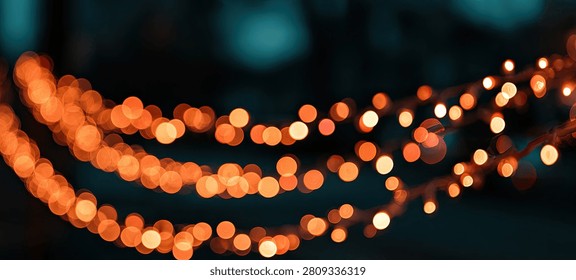 A beautiful abstract background featuring soft, out-of-focus orange bokeh lights creating a warm and festive atmosphere.