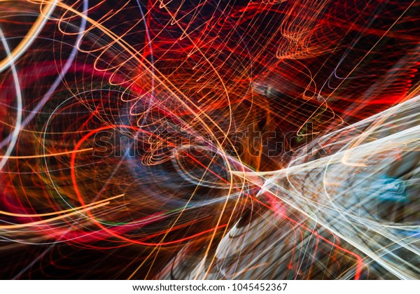 Beautiful Abstract futuristic painting color\
texture with lighting effect. Modern dynamic shiny pattern. Fractal\
graphic artwork design. Creative long exposure photography.\
Abstract lights at\
night.