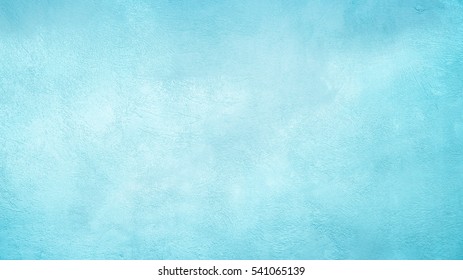 Beautiful Abstract Grunge Decorative Light Blue Cyan Painted Stucco Wall Texture. Handmade Rough Winter Christmas Paper Wide Background With Copy Space Stock Photo