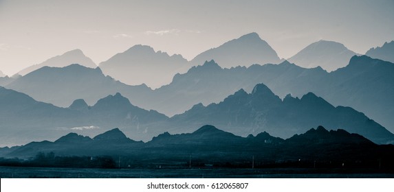 A beautiful  abstract monochrome mountain landscape in blue tonality  Decorative  artistic double exposure in black   white style 