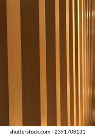Beautiful abstract pattern of light color wood vertical stripe in angle with edge, wall decorated with wooden planks, Futuristic geomatric wall design, wood pattern
