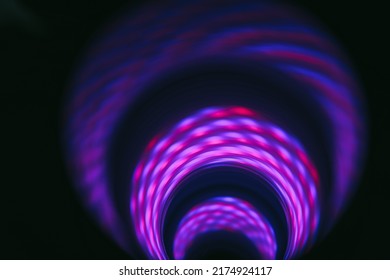 Beautiful Abstract swirl tunnel with violet light on a background pattern textured for design.