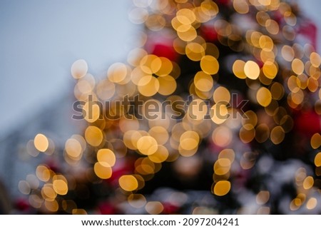 Beautiful abstraction blurred lights garlands for the banner. Stylish light bulb background without focus