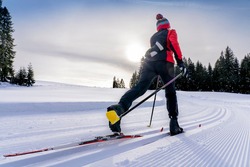 Beautiful Active Senior Woman Cross-country Skiing In Fresh Fallen Powder Snow In The Allgau Alps Near Immenstadt, Bavaria, Germany