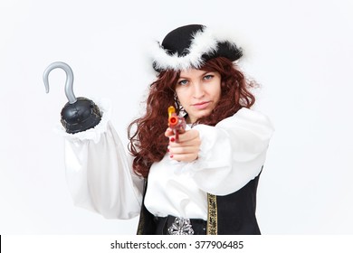 Beautiful actress in pirate costume with pistol and hook