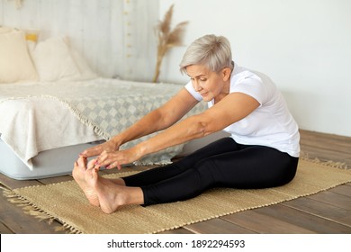 Beautiful Adult Woman Doing Yoga At Home