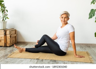 Beautiful Adult Woman Doing Yoga At Home