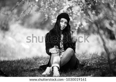 Similar – a girl with long hair and blue eyes in the mountain covering her face with her hair