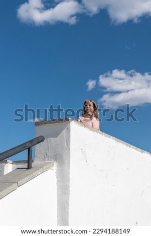 Similar – Young blonde woman in a sunny day in the city