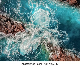 Beautiful aerial birds eye view on ocean waves, Fuerteventura island. Aerial shooting seascape coastline at sunny day. Travell, Beach,islands, Nature, freedom concept.
