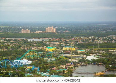 Beautiful Aerial City View Of Orlando Taken From Helicopter. Panoramic Photo Of Skyline With Buildings, Roads And Parks. Green Space.