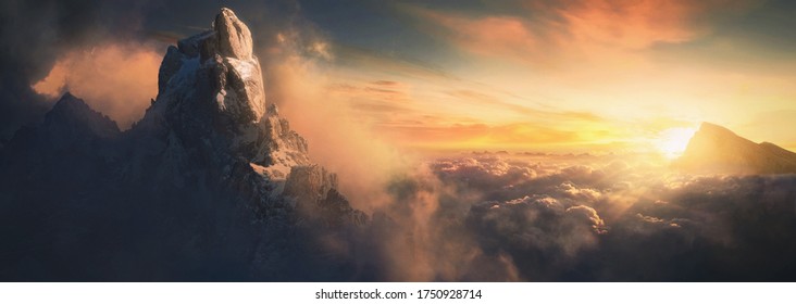 Beautiful aerial landscape of mountain peak at sunset above the clouds - panoramic - Powered by Shutterstock