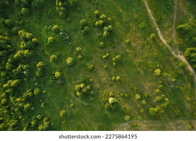 Beautiful aerial landscape on green backdrop. Beautiful scenery. Beautiful natural landscape. Natural background. Air transportation. Aerial view. Top view. - Shutterstock ID 2275864195