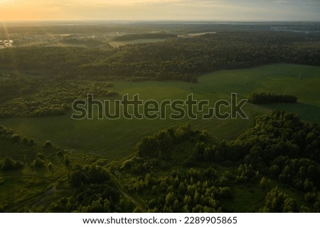 Beautiful aerial landscape on green backdrop. Beautiful scenery. Beautiful natural landscape. Natural background. Air transportation. Aerial view. Top view.