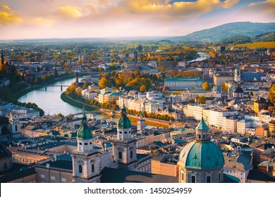 Beautiful of Aerial panoramic view in a Autumn season at a historic city of Salzburg with Salzach river in beautiful golden evening light sky and colorful of autumn at sunset, Salzburger Land, Austria
