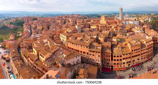 Beautiful aerial panoramic view of Siena Cathedral, Duomo di Siena, and Old Town of medieval city of Siena in the sunny autumn day, Tuscany, Italy
