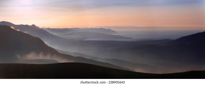 Beautiful Aerial Perspective In The Mountains, Haze In The First Rays Of The Sun