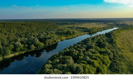 Beautiful aerial shot of an untouched wild river landscape. Gorgeous summer view of a river flowing through the untouched forest on a bright spring day. A drone shot of a wild natural river terrain.  - Powered by Shutterstock