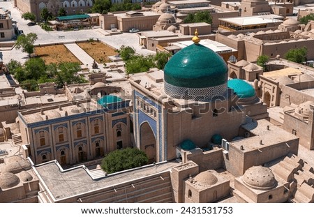 Beautiful aerial view of the 2500-year-old Uzbek city Khiva. Ancient Itchan Kala fortress, Mosque, market and houses in Historic Center of Khiva (UNESCO World Heritage Site), Uzbekistan, Central Asia