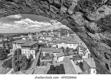 Beautiful aerial view of Bergamo Alta cityscape framed by wall, Italy.