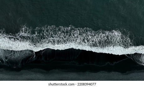 Beautiful Aerial View Of Black Beach. Sea Ocean Waves Reaching Shore.