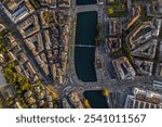 Beautiful aerial view of the city of Zurich in Switzerland - the Limmat River and its iconic churches, buildings rivers and Clockes.