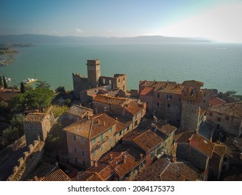 Beautiful Aerial View Of Cityscape With Ruins Of Medieval Castle In Passignano Town In Italy