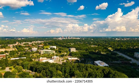 A Beautiful Aerial View Of Greensboro With Forests And Buildings On A Sunny Day In Piedmont Triad, NC