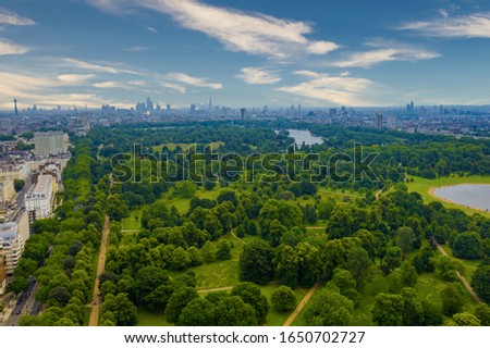 Beautiful aerial view of the Hyde park in London, UK with London city on the horizon. 