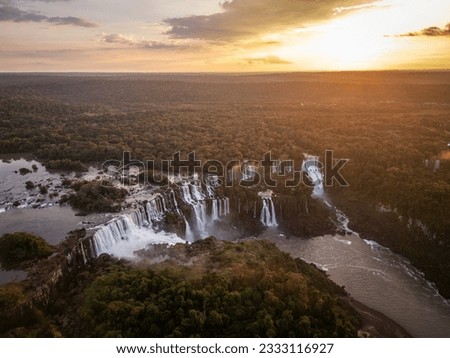 Beautiful aerial view to Iguassu Falls waterfalls with sunset clouds