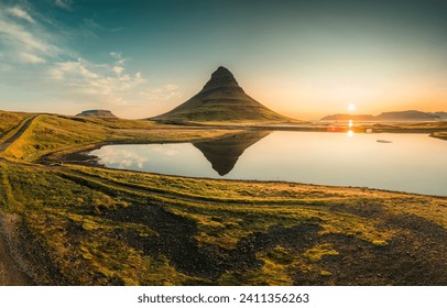 Beautiful aerial view of Kirkjufell volcanic mountain reflect on lake during autumn in the morning at Snaefellsnes peninsula, Iceland - Powered by Shutterstock