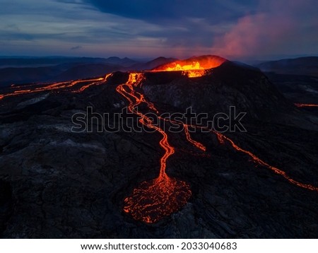 Beautiful aerial view at night of the Active Volcano with red Lava in Iceland